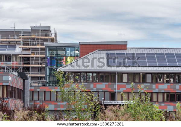 Newport, Wales UK 08/10/2018 Office for National\
Statistics Government Buildings, Cardiff Rd, Duffryn. Building\
showing the vibrant design, solar panels and scaffolding work being\
carried out.
