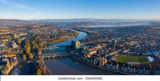 Newport, Wales, UK – November 18, 2019: An aerial view at sunrise of Newport city centre, south wales United Kingdom, taken from the River Usk