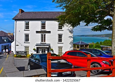 Newquay, Ceredigion / Wales UK - 5/30/2019: The Black Lion Hotel In Newquay, W.Wales. Cars Parked In Front. Stunning Coastal Sea Views From Rear Beer Garden, Of Cardigan Bay.