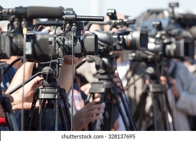 News Conference. Filming An Event With A Video Camera.