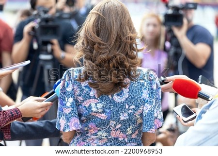 Similar – Image, Stock Photo Journalist holding microphone making media interview