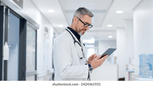 News, tablet or mature doctor in hospital with research on website to search for medicine info online. Man reading, senior or medical healthcare nurse browsing on technology for telehealth in clinic - Powered by Shutterstock