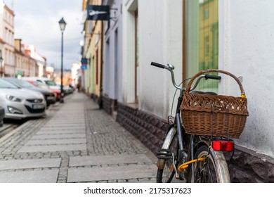 Newspaper In A Bicycle Basket Parked By A Old Tenemet House Wall In Świebodzice, Poland