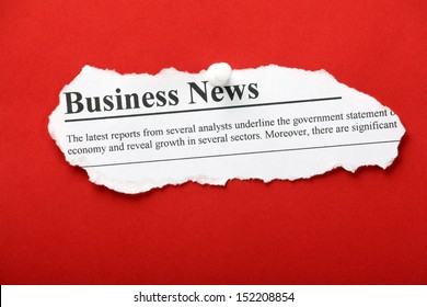 A Newspaper Clipping With The Banner Headline Business News