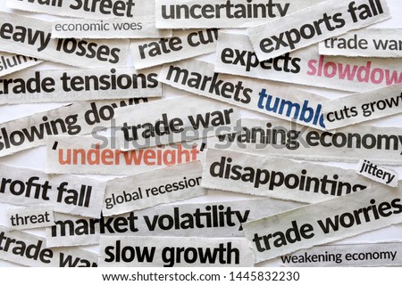 Newspaper cutout of headlines reporting on trade war and the impact on the economy and financial markets presently hogging major dailies and media. Concept for US versus China, Europe trade war.