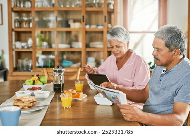 Newspaper, eating breakfast and senior couple with tablet for reading morning news, story and update. Food, man and woman with technology in retirement home for article, online information and relax - Powered by Shutterstock