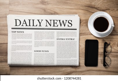 Newspaper With The Headline News And Glasses And Coffee Cup On Wooden Table, Daily Newspaper Mock-up Concept