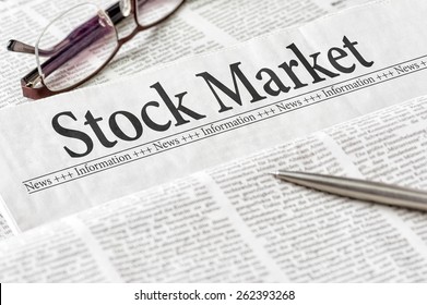 A newspaper with the headline Stock Market
