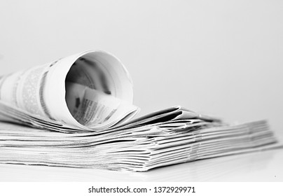 Newspaper On A Table In A Office With White Background No People Stock Photo