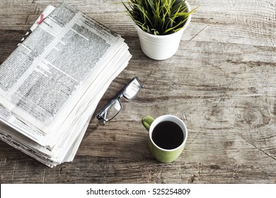 Newspaper On Wooden Table