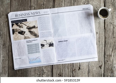 Newspaper On Wooden Table