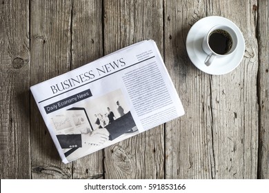 Newspaper On Wooden Table