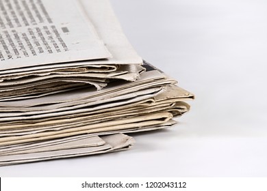 Newspaper Piled Up On A Table In A Office With White Background No People Stock Photo