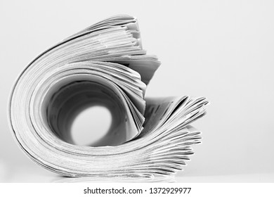 Newspaper Piled Up On A Table In A Office With White Background No People Stock Photo