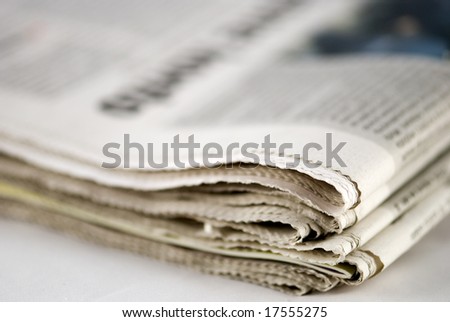 newspaper stack on white background