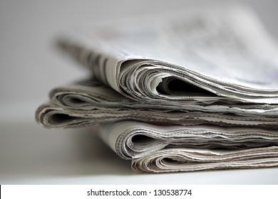 Newspapers folded and stacked concept for global communications - Shutterstock ID 130538774