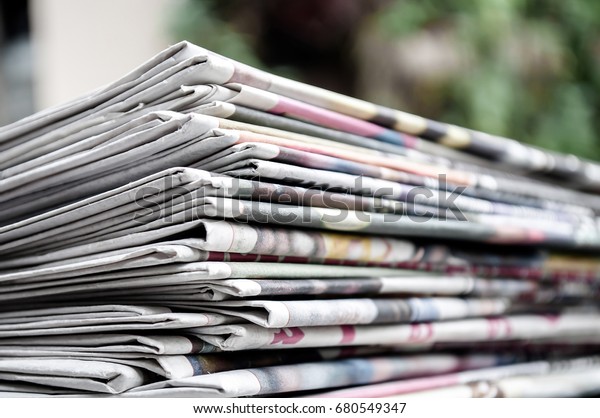 Newspapers Folded Stacked On Table Garden Stock Photo (Edit Now) 680549347