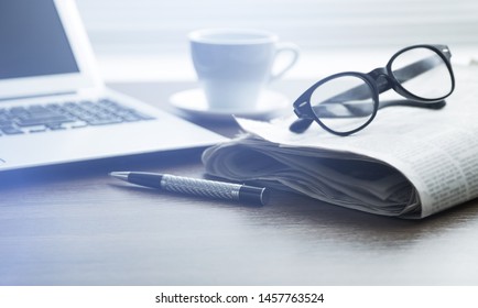 Newspapers With Glasses And Laptop. Online News.