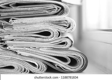 Newspapers and magazines folded and stacked, side view  - Shutterstock ID 1188781834