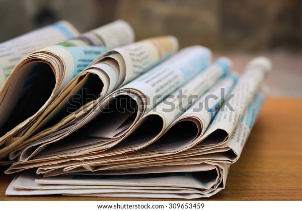 Newspapers on the\
table