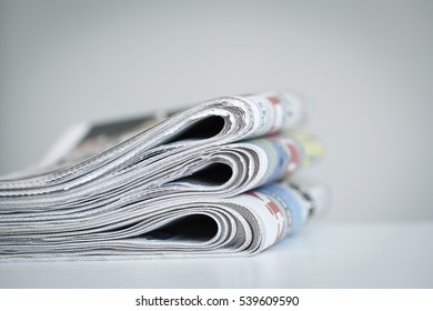 Newspapers on white background - Shutterstock ID 539609590