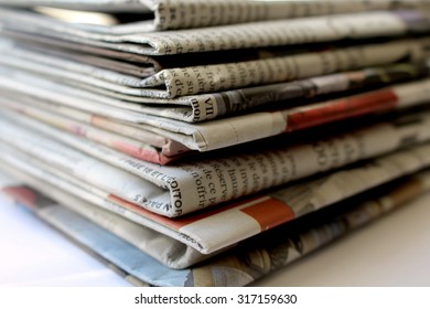 Newspapers
This is a photograph of newspapers stacked one on the other

