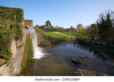 Newstead Abbey, Nottinghamshire, UK 03 25 2022 Waterfall flowing into a pond scene