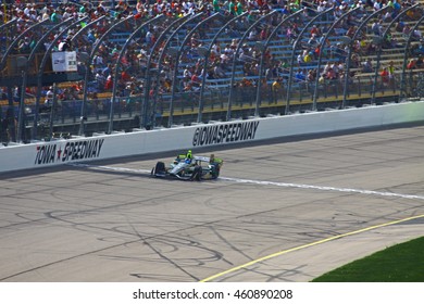 Newton, Iowa USA - July 9, 2016: Verizon IndyCar Series Iowa Corn Indy 300. Josef Newgarden Race Winner Leads, Crossing The Finish Line. Checkered Flag.