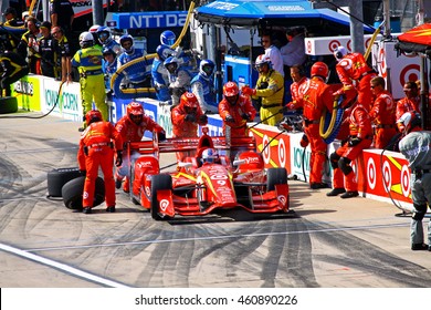 Newton, Iowa USA - July 9, 2016: Verizon IndyCar Series Iowa Corn Indy 300. Scott Dixon Pit Stop Action Splash. Indy Car Racing Teamwork