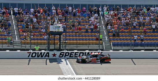 Newton Iowa, USA - June 18, 2016: Sam Hornish Jr. Winner Receives Checkered Flag At Finish Line. NASCAR Xfinity Series, American Ethanol E15 250 Race. Iowa Speedway.