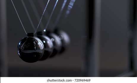Newton's cradle physics concept for action and reaction or cause and effect. Balls Newton - Shutterstock ID 720969469