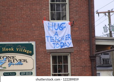 NEWTOWN, CT., USA-DEC 16: Sandy Hook Elementary School Shooting, Hug A Teacher Hanging Sign, Dec 16, 2012 In Newtown, CT., USA