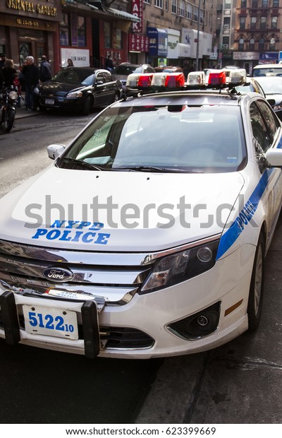 New-York, USA - NOV\
18: Parked police car in a busy Chinatown street on November 18,\
2012 in New-York,\
USA.