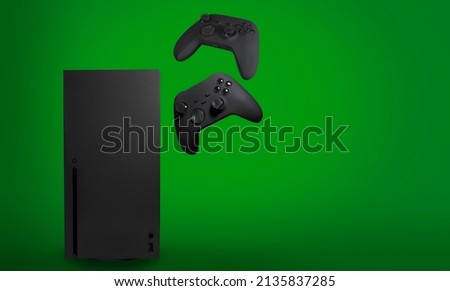 Next Generation console and controllers with green background.