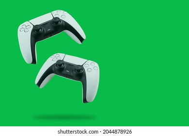 Next Generation Controllers falling on green background. - Powered by Shutterstock