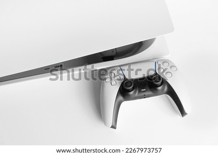 Next Generation game console and controller in close view