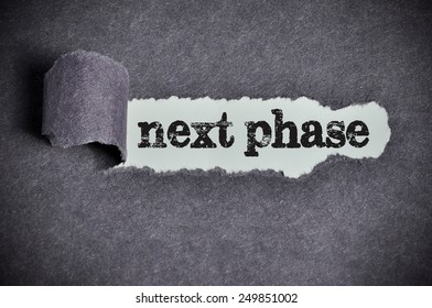 Next Phase Word Under Torn Black Sugar Paper 