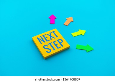 Next step concepts with text on notepaper and direction of arrow.Business action plan