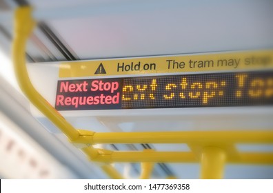 Next Stop Sign Inside City Tram Train.