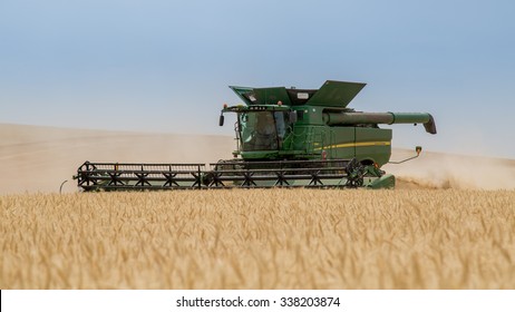 NEZPERCE, IDAHO/USA  AUGUST 9, 2015: John Deere S690 combine harvesting a field of wheat in Idaho.
