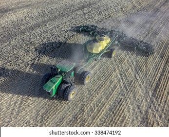 NEZPERCE, IDAHO/USA OCTOBER 3, 2014: A John Deere 9560R tractor and Air Drill planting a field of wheat in Idaho.