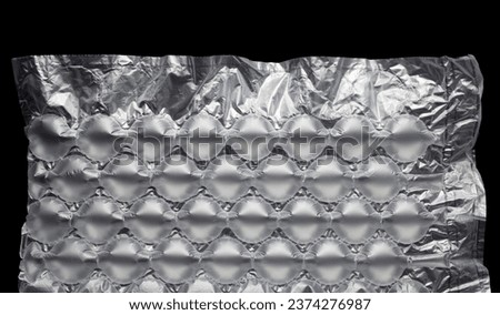 nflatable air buffer plastic bag on black background. protective packages.