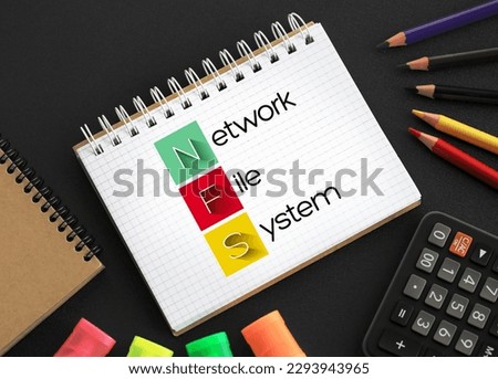 NFS Network File System - mechanism for storing files on a network, acronym text concept on notepad