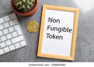 NFT non - fungible tokens inscription in the art frame. A non-fungible token (NFT) is a special type of cryptographic token which represents something unique.