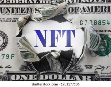 NFT ( Non-Fungible Token --  a blockchain asset) text in a torn dollar bill                               