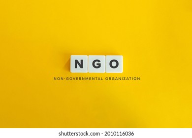 NGO (Non Governmental Organisation) banner and concept. Block letters on bright orange background. Minimal aesthetics. - Shutterstock ID 2010116036