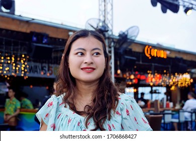 Nha Trang, Vietnam  -  16th February 2020; Happy Young Asian Girl At Skylight Rooftop Bar Restuarant Decorated With Light  In Late Evening                  