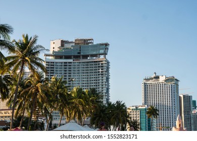 NHA TRANG, VIETNAM - JANUARY 25, 2019. Scenic summer view of the modern architecture with business skyscrapers, hotels and apartment buildings with a palm trees.
