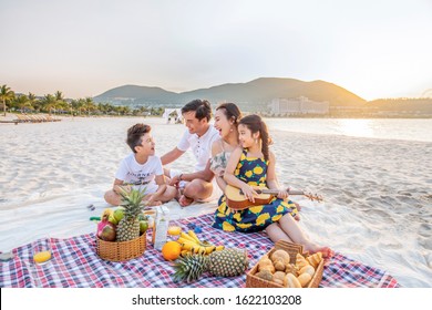 Nhatrang, Vietnam, 062319: Happy Asian Family Father ,Mother, Son And Daughter Having Party On The Beach Vacation Togetherness In Summer