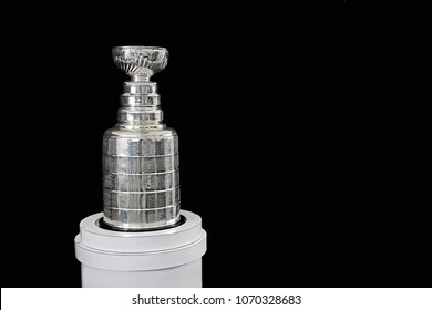 NHL Trophy - Silver Stanley Cup on white stand with black background, in Vancouver BC on November 3, 2018